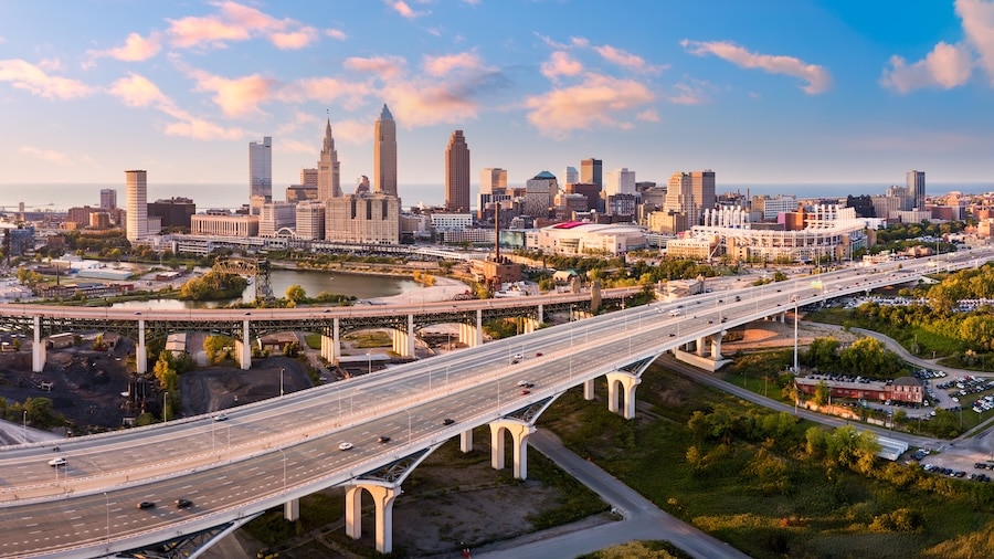 Aerial view of Cleveland, Ohio skyline and I90 interstate highway at sunset. Cleveland is a major city in the U.S. state of Ohio and the county seat of Cuyahoga County.